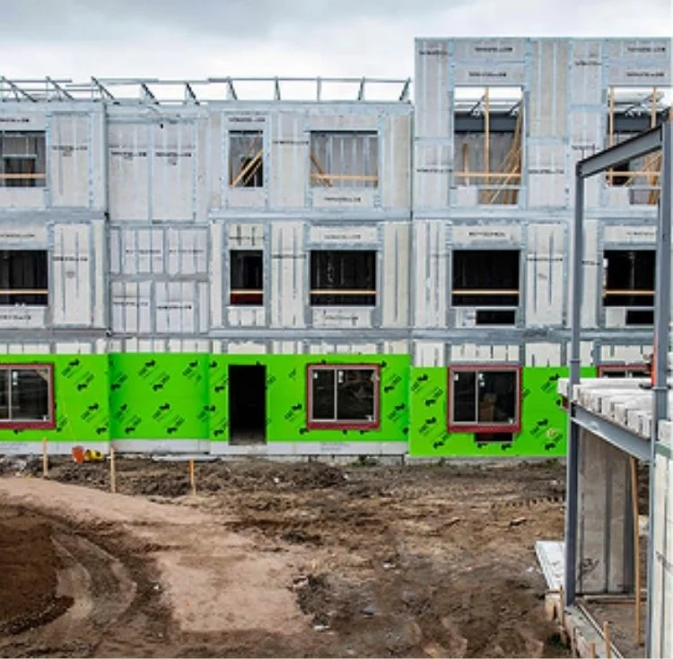 Multi-story building under construction with structural insulated panels for an Arkansas project
