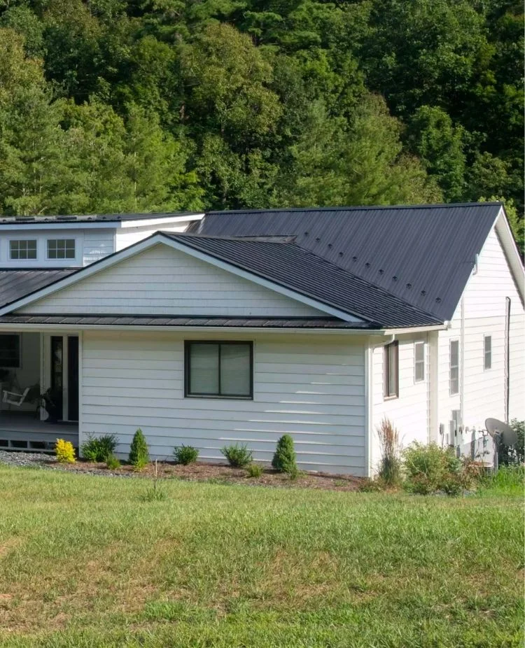 Close-up of a Connecticut home's metal roof and SIP panel wall system