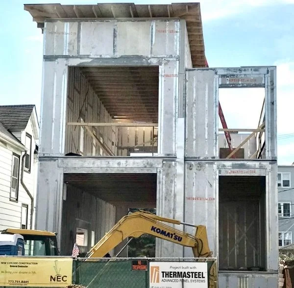 Kentucky (3) Multi-story panel building frame with excavator on-site