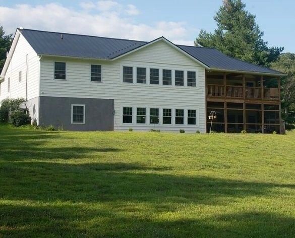 Michigan (2) Finished two-story home with metal roof and screened porch