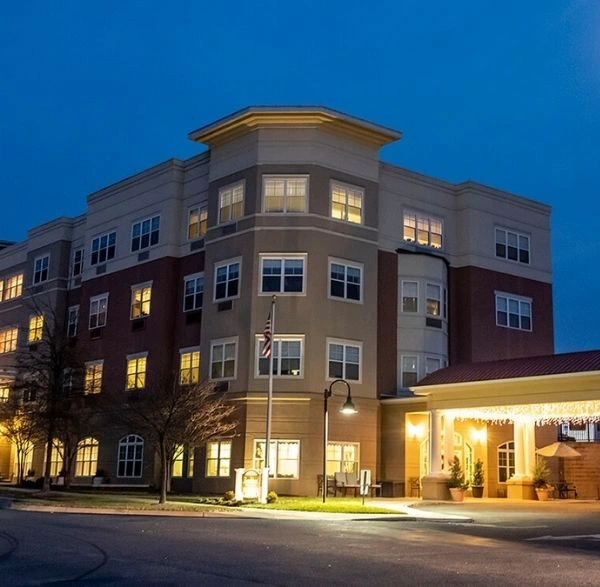 Michigan (3) Multi-story building illuminated at night with covered entrance