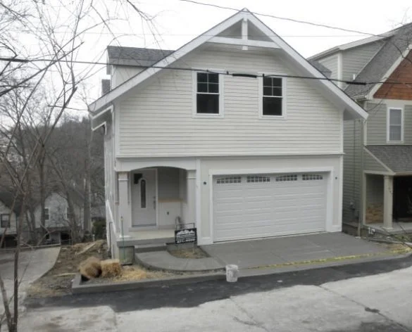 Ohio (2) Two-story home with covered porch and two-car garage