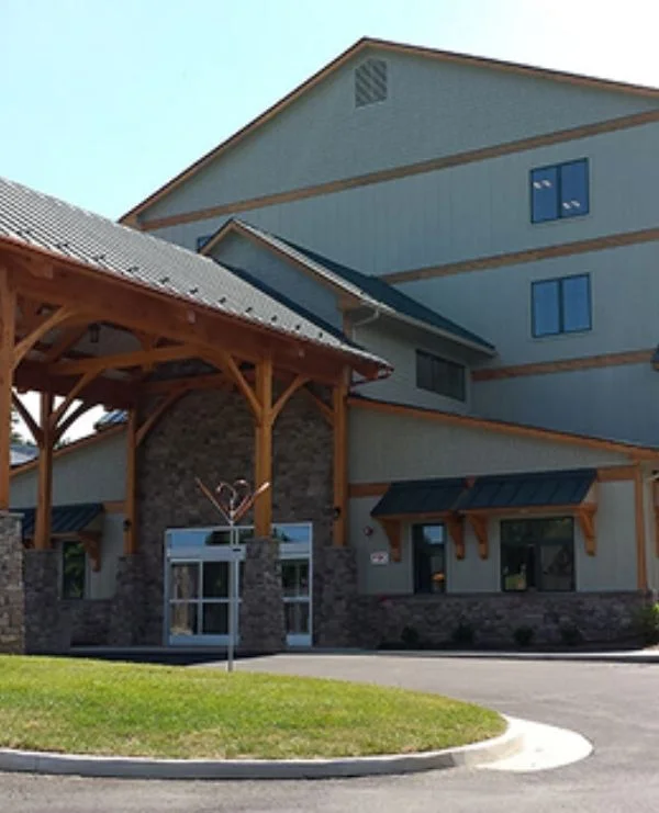 Ohio Lodge-style building with timber entrance canopy and stone base